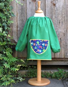 Traditional children's green linen smock, Forest Friends pocket