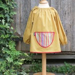 Traditional children's mustard linen smock, Stripes pocket