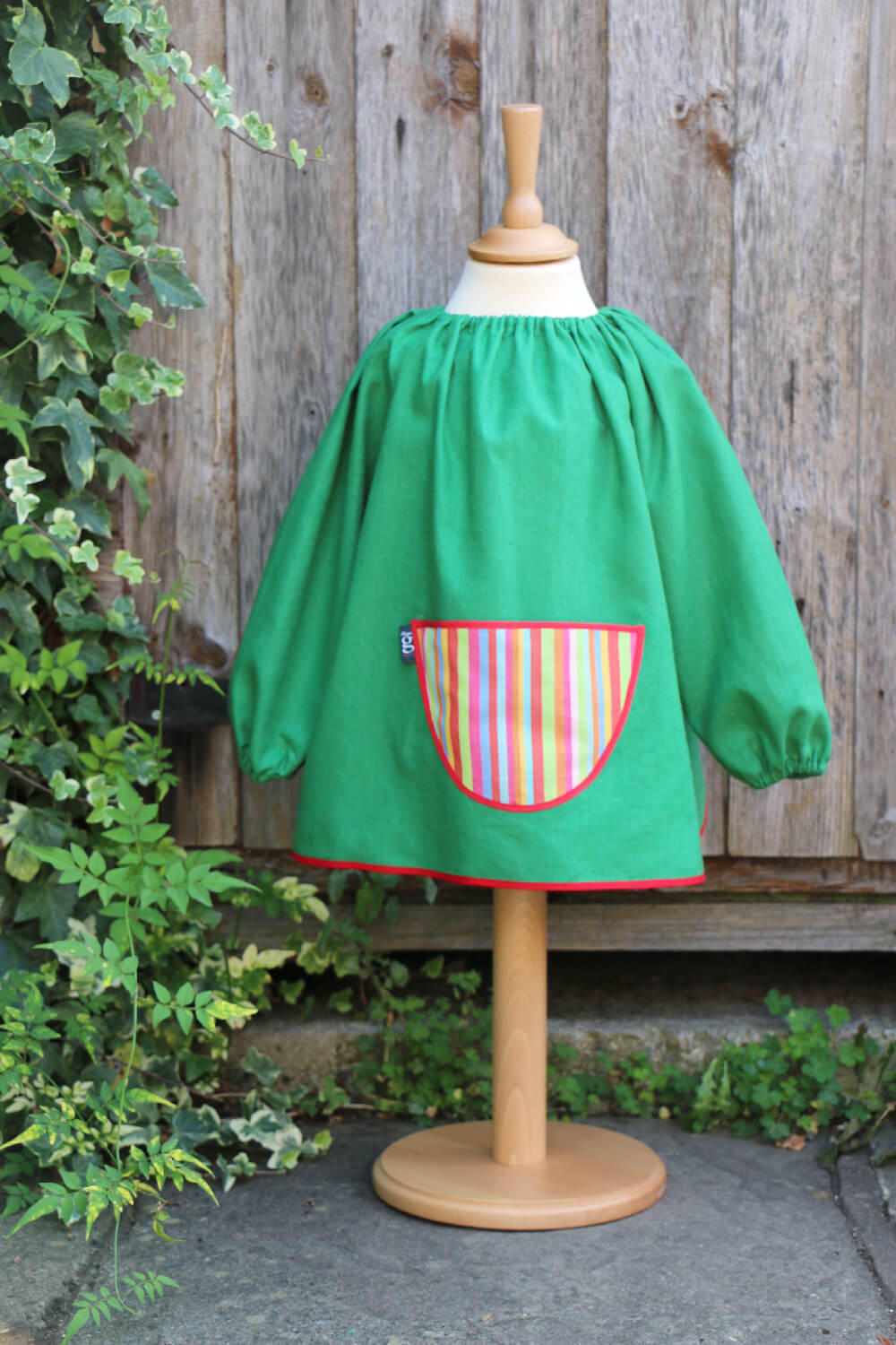 Traditional children's green linen smock, Stripes pocket